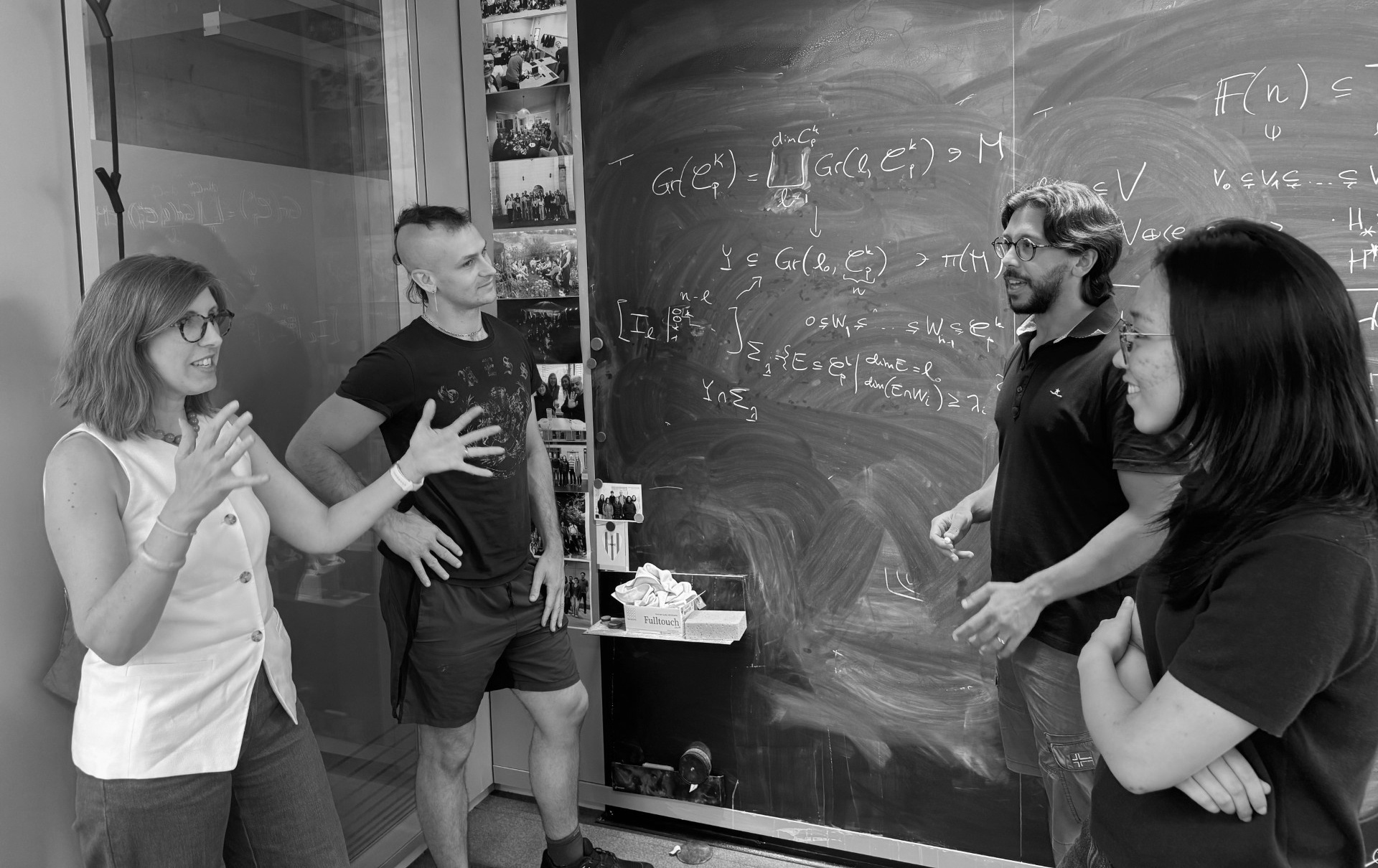 Members of the ASB group at a blackboard